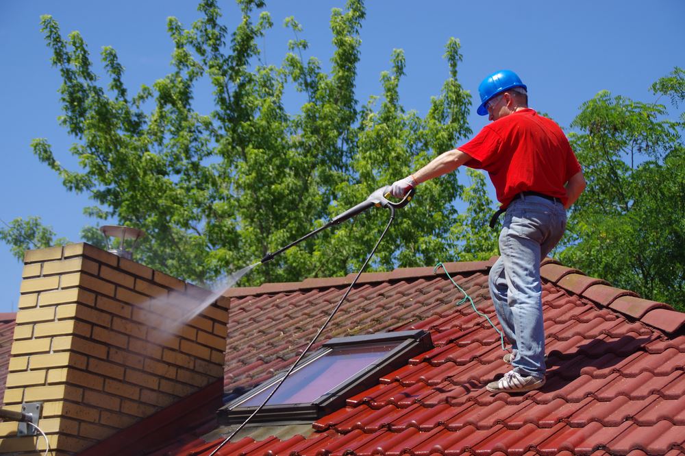 House roof cleaning with pressure tool